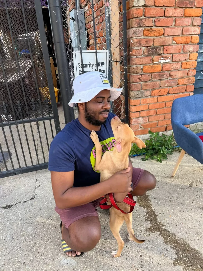 A man says goodbye to a dog he rescued.